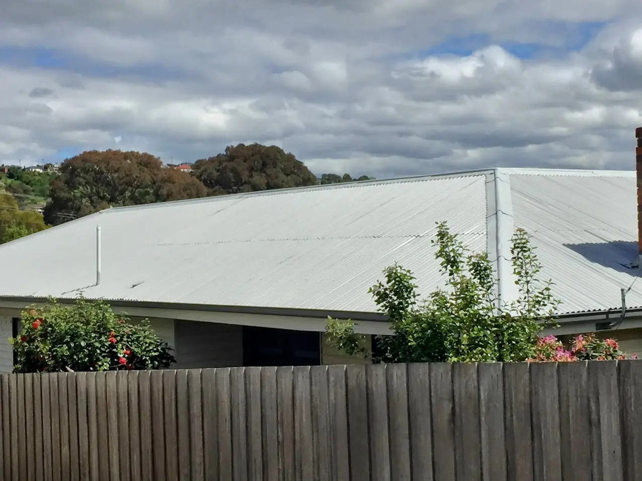 Light grey corrugated metal roof after repainting in Launceston