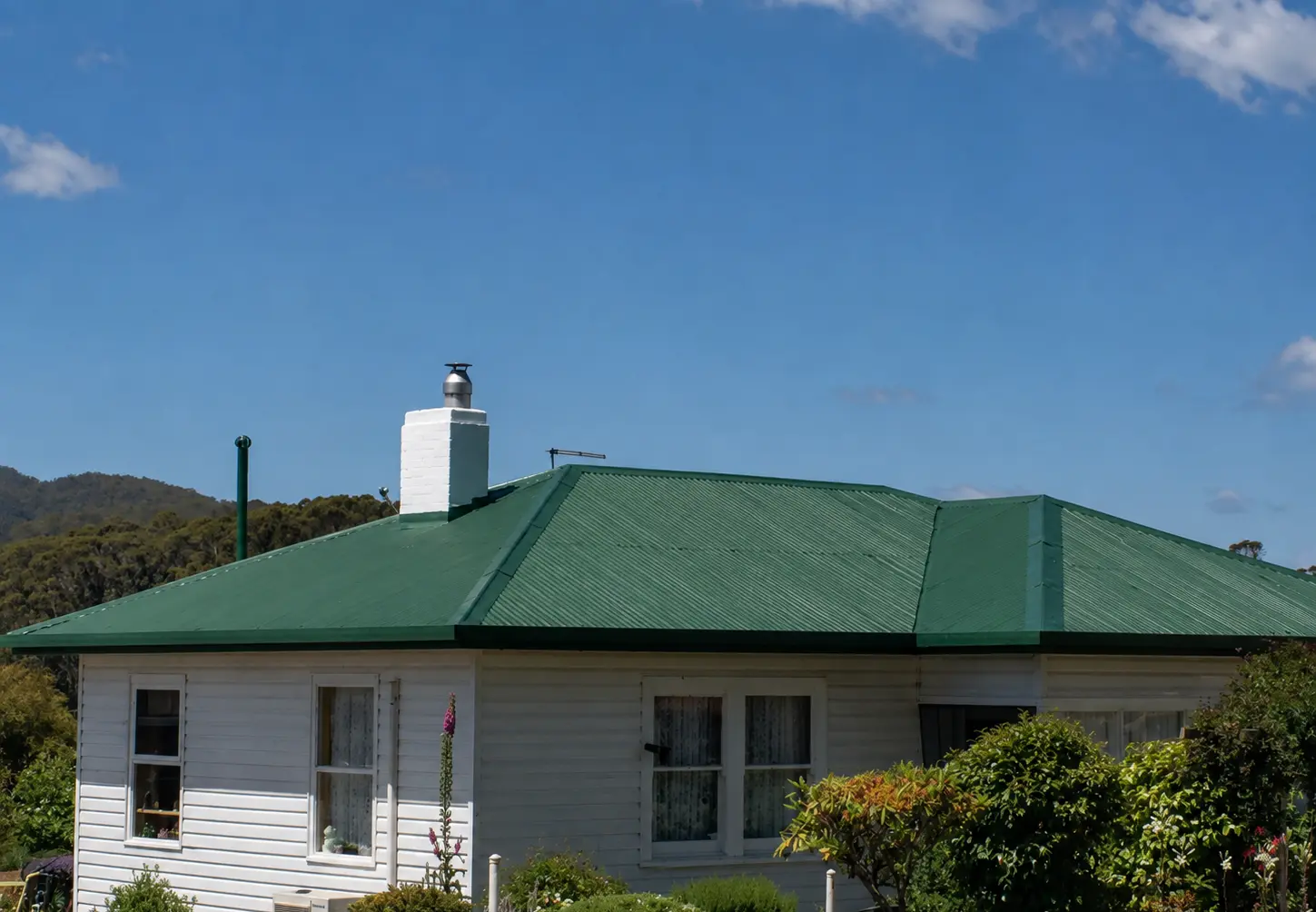 Green coated metal roof on a Tasmanian weatherboard home